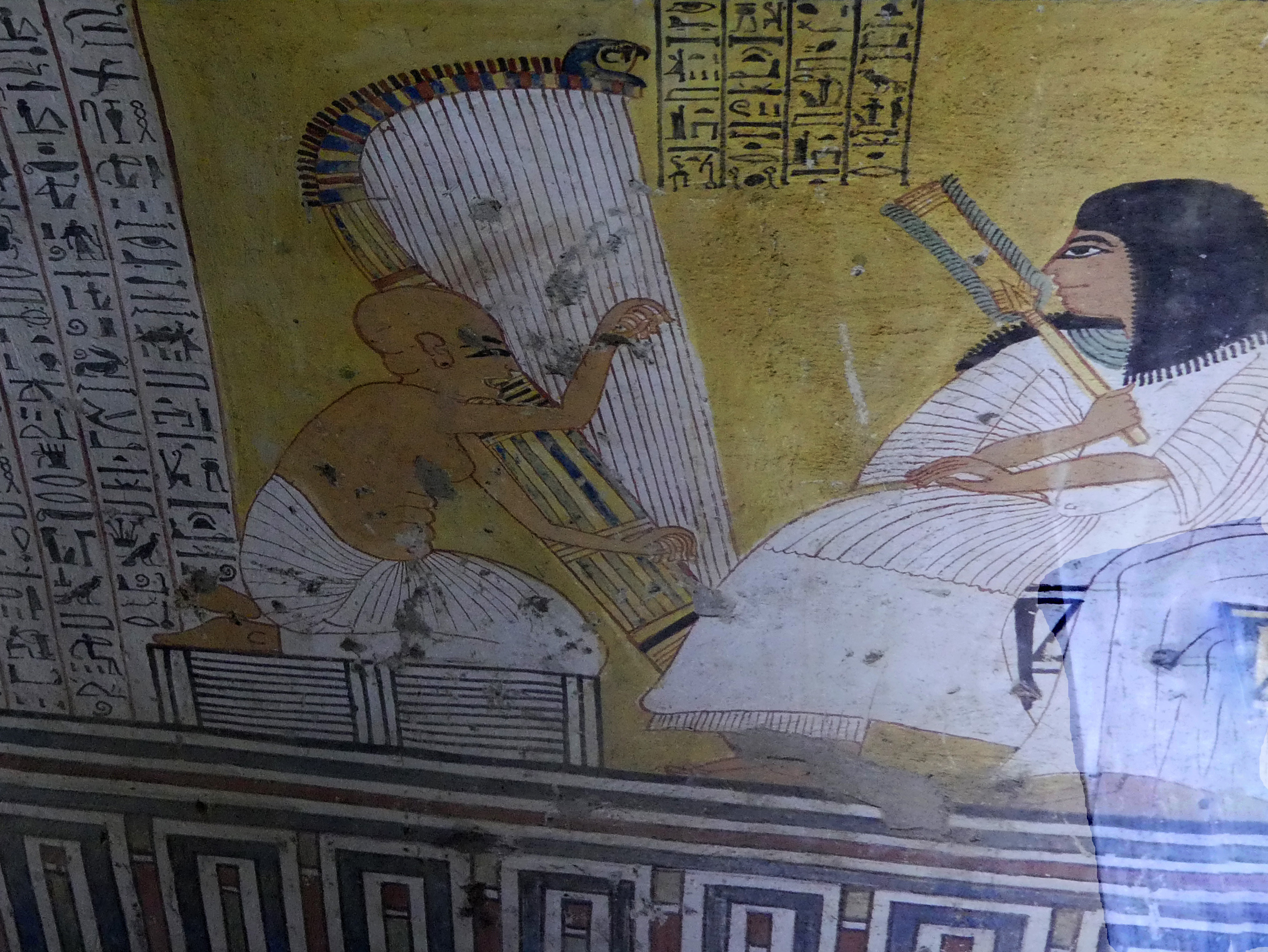 Inherkhau with harpist